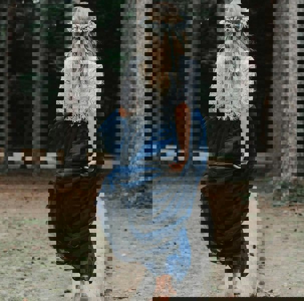 young girl walking in woods