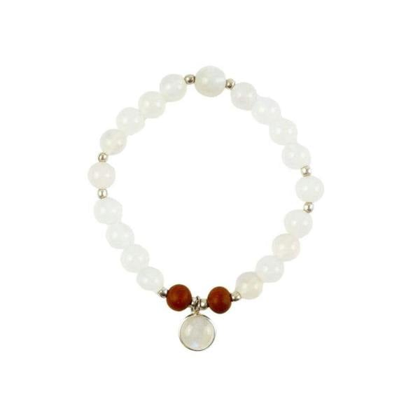 Selene purity mala bracelet by Kati Kaia with white beads, brown accents, and central pendant