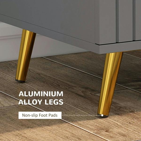 Gold-tone aluminium alloy legs with non-slip foot pads under a dark grey dresser