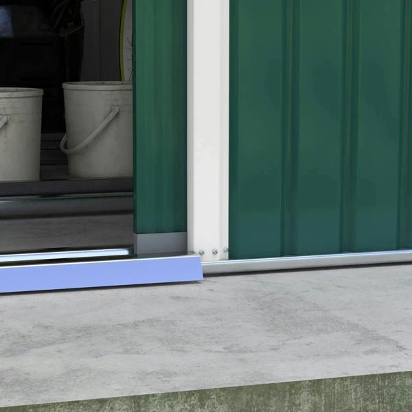 Steel base rails at the green storage shed doorway over a concrete surface