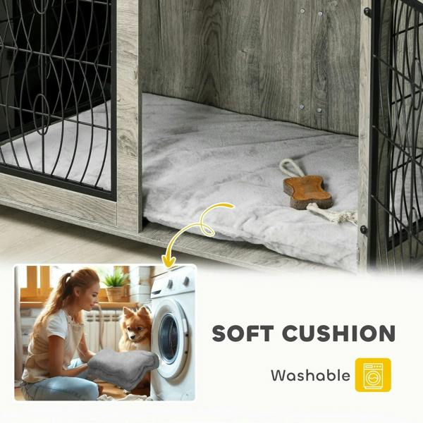 Grey interior of dog crate furniture table with soft cushioned bedding at the bottom