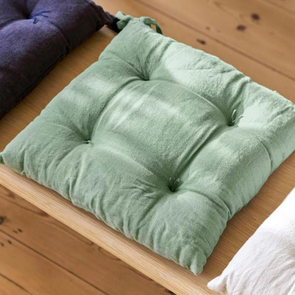 A top-down view of the Rosemary green quilted seat pad.
