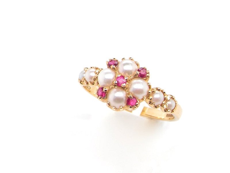 Vintage Tom A pretty pearl and ruby cluster dress ring