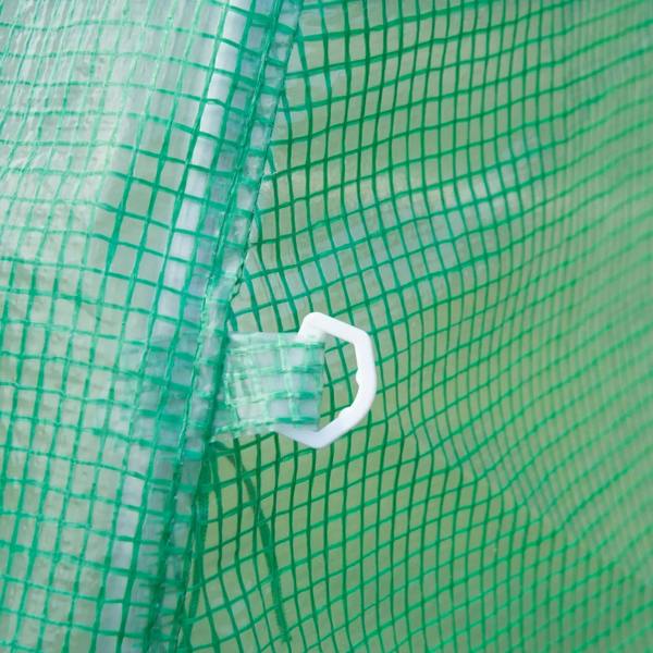 Close-up of green mesh greenhouse cover with white tie fastener