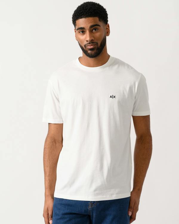 Model wearing a Armani Exchange Mens A|X Monogram T-Shirt in Off White
