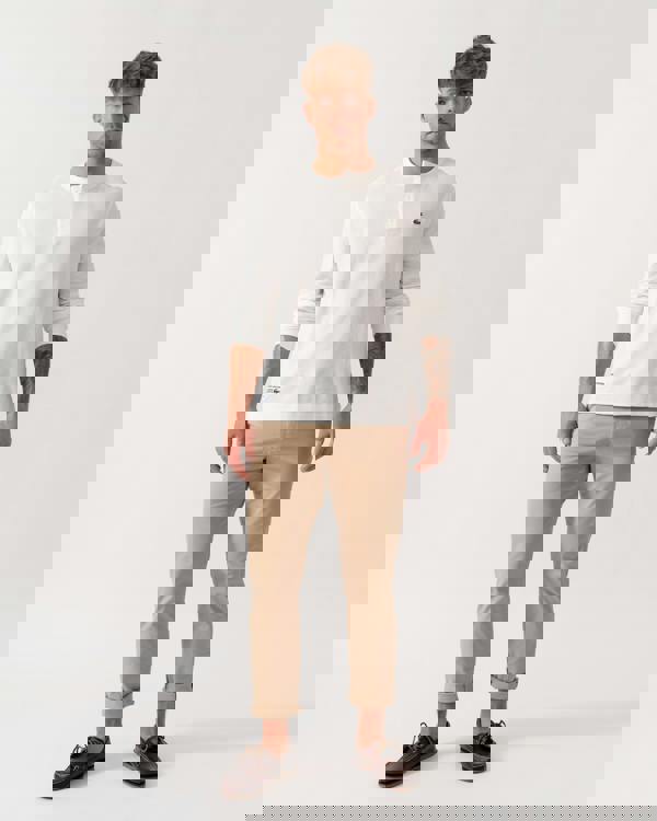 Model wearing Lacoste Boxy Tunisian Neck Knit T-Shirt in Flour 70V - Full Length