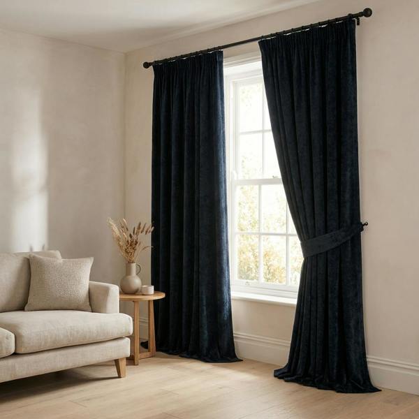 Tuvalu made-to-measure curtains in Midnight, styled in a living room