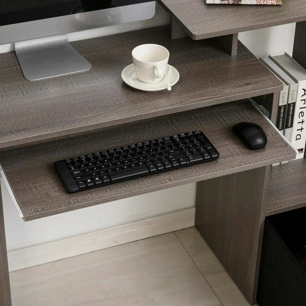 Grey computer desk with sliding keyboard tray and keyboard on upper shelf