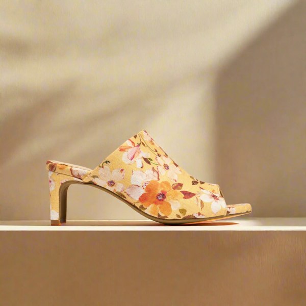 Debbie yellow mules side view