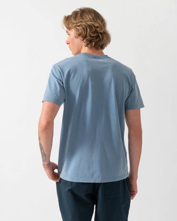 back shot of a model wearing a Colorful Standard Classic Organic T-Shirt in Faded Indigo