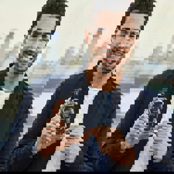 Anfar Midnight Homme Intense 100ml Extrait Parfum held by man smiling