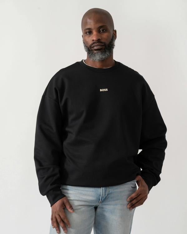 Model wearing a BOSS Green Stenson Mens Crew Neck Sweatshirt in Black