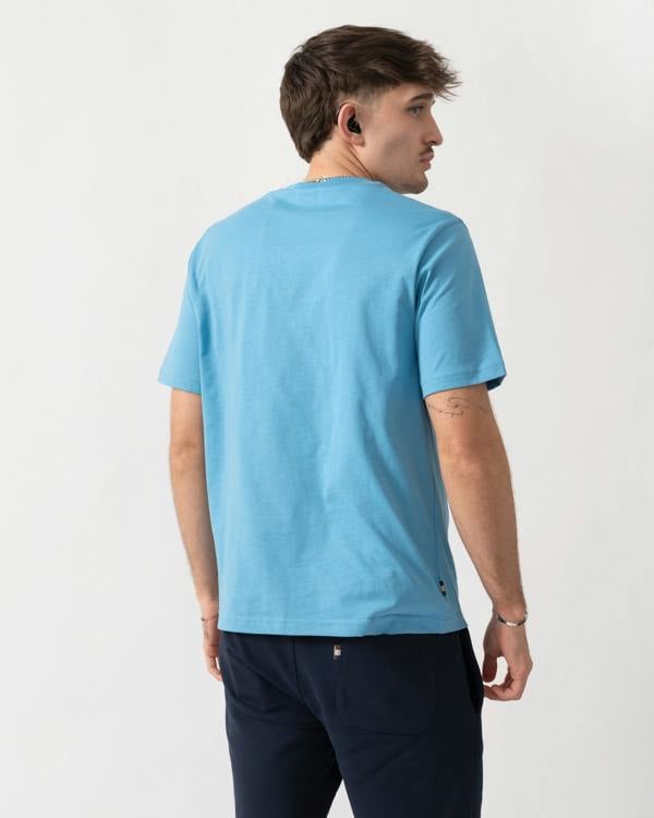 back shot of a model wearing an Aquascutum Mens Small Logo T-Shirt in Avio 18