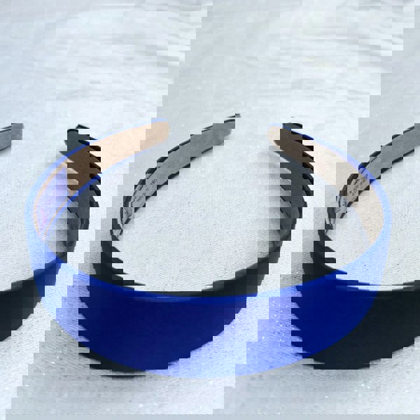 Royal blue hairband, smooth satin finish, bold deep blue shade, padded structure, sleek minimalist design, versatile fashion accessory
