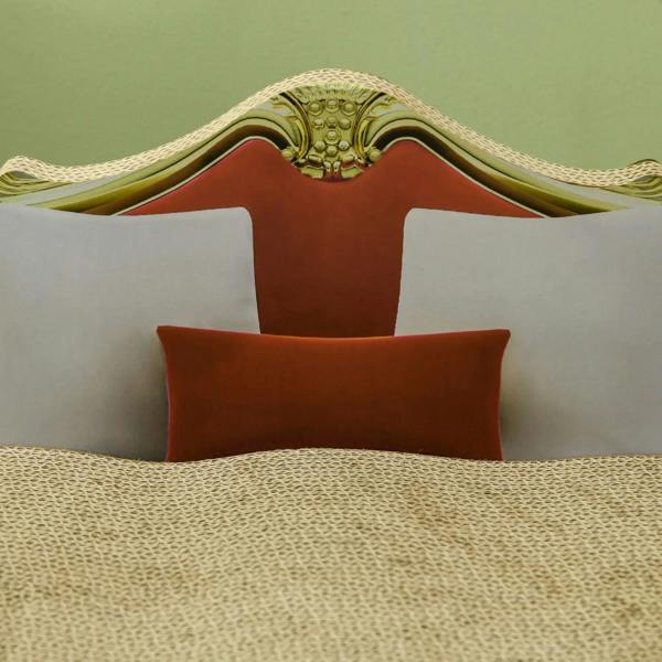 Cat cardboard scratcher lounge sofa bed with red backrest and white side panels, beige top