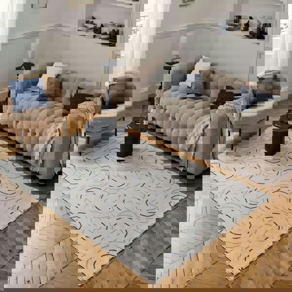 Living Room rug, blue-cream colours, geometric, practicality in mind, the rug is anti-allergic.