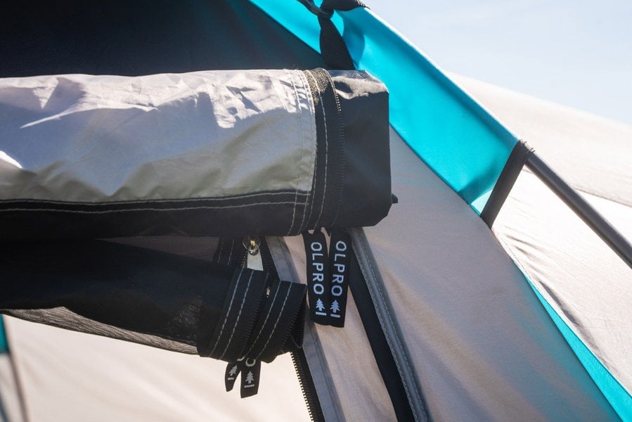 A closeup of the roll up door and zip tag for the Stafford 4.0 OLPRO x Ed Stafford.