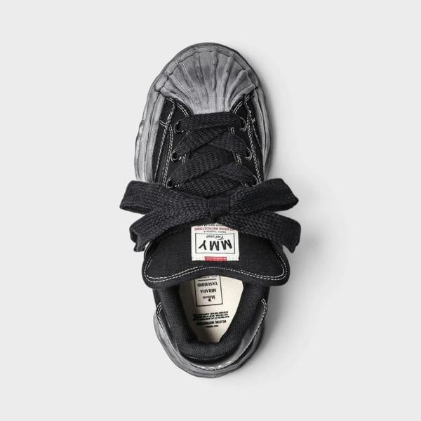 Supplied Fashion Maison Mihara Yasuhiro Blakey Puffer black canvas sneaker with signature distressed OG sole top view
