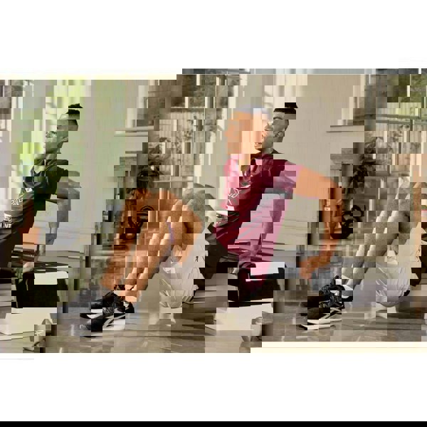 Man working out on a Reebok Step Fitness Training - White