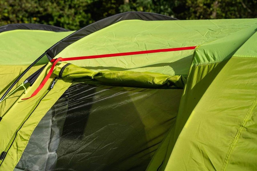 A close up image showing a red strap that attaches the Abberley XL Extension to the Abberley XL Tunnel Tent by OLPRO.