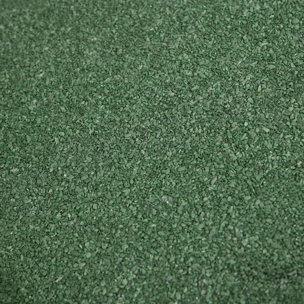 Green textured asphalt shingle roof surface