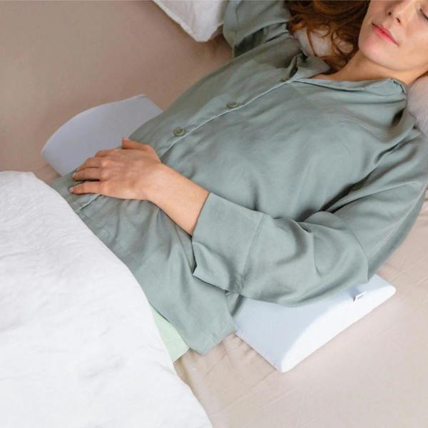 Bed Back Support Pillow - Putnams Place this D shaped firm pillow under the small of your back to support the natural S shape of the spine during sleep. Gives pressure relief to the back when in pain.