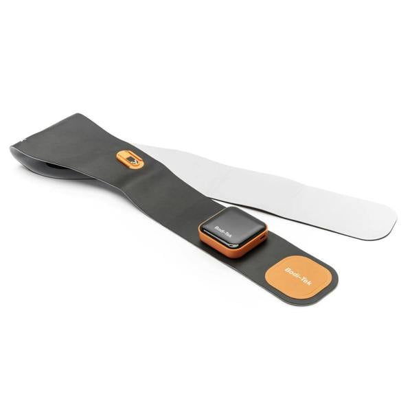 A black and orange Ab & Back Muscle Strengthener with heat, featuring an attached control unit and gel pads, is laid flat on a white background.