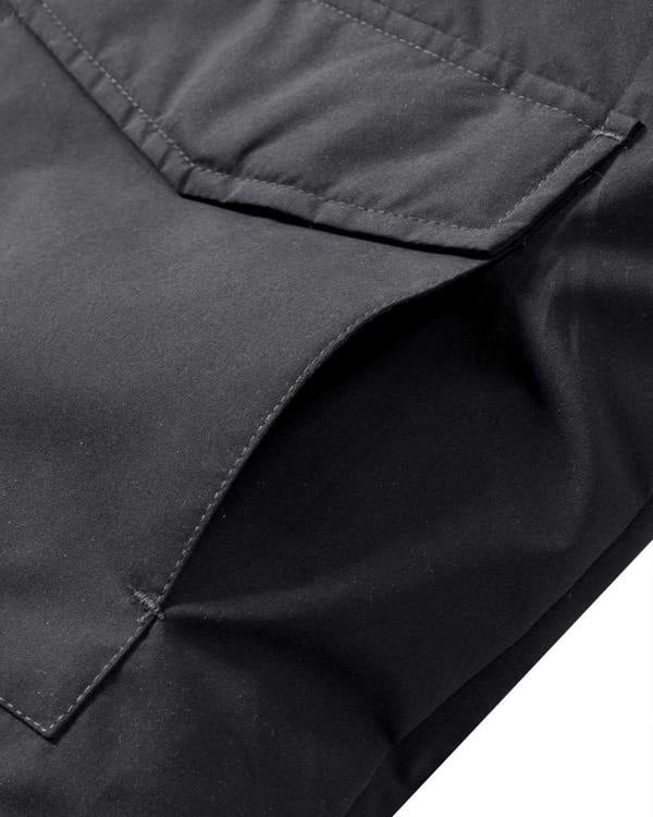 Lambretta Mens Padded Hooded Classic Badge Jacket Coat, close-up of black fabric showing quilting and pocket details.