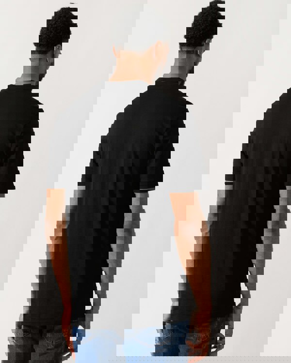 back shot of a Model wearing a BOSS Orange Dobermann Mens Bear Graphic T-Shirt in black