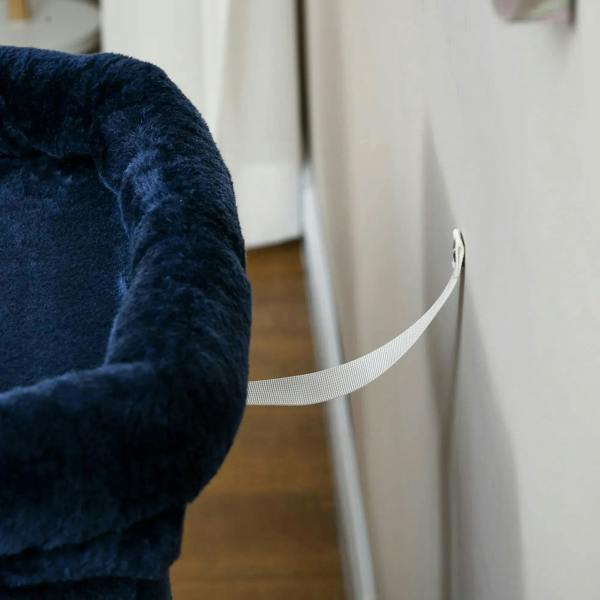 Navy blue cat tree close-up of cream sisal scratching ramp with stitched edge