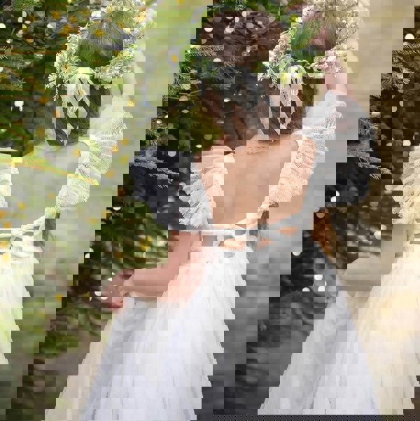 Sofia dress behind detailing with girl looking at tree