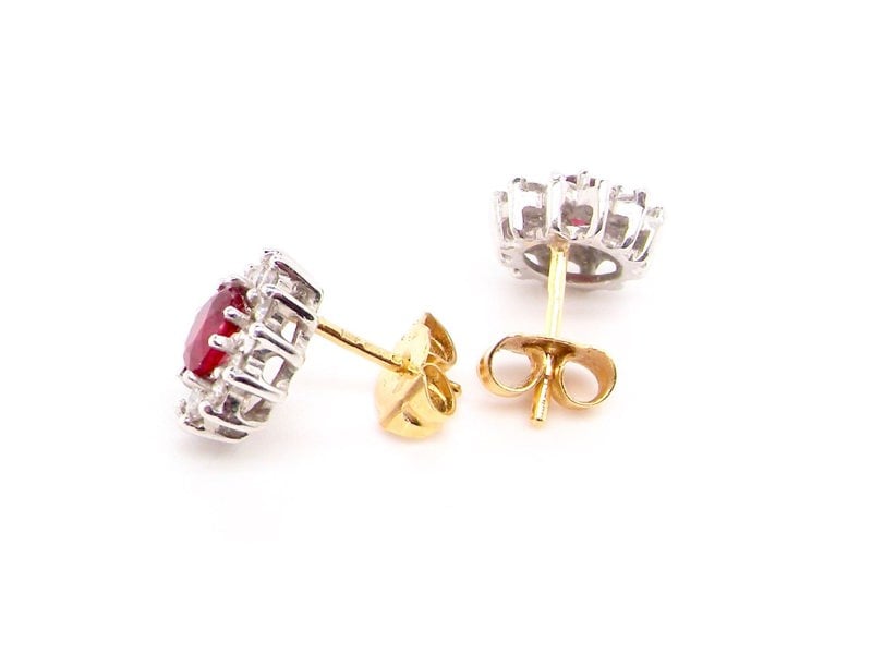 Vintage Tom A pair of ruby and diamond cluster earrings