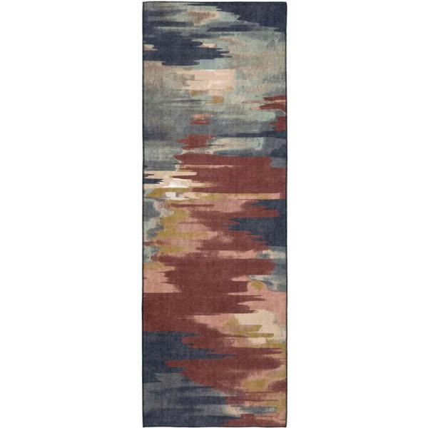 Long, narrow rug with abstract pattern on a white background
