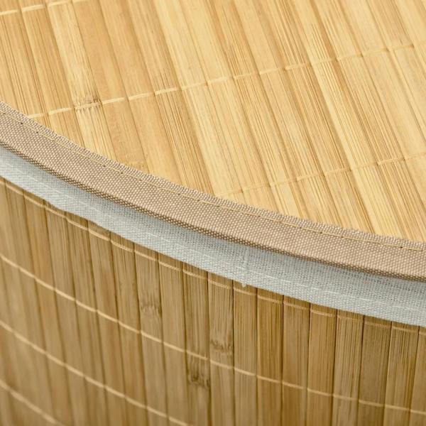 Close-up of bamboo laundry hamper rim with white fabric lining edge and stitched seam.