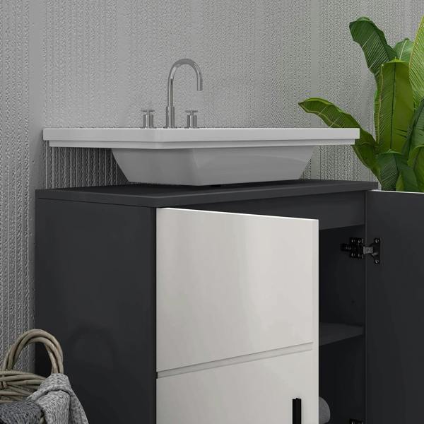 Light grey under-sink cabinet with door open to reveal interior storage compartment