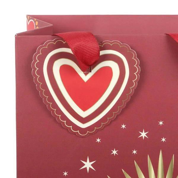 Maroon gift bag with large sacred heart applique and red ribbon handle loop