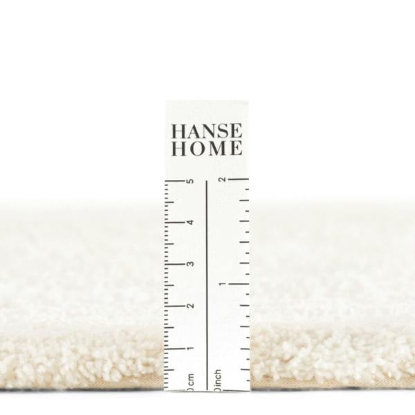 Nursery rug pile, soft and durable materials.