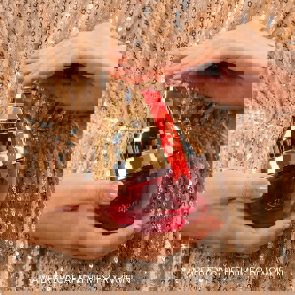 Sapil Rouge Eau de Parfum 100ml elegant gold red bottle in hand