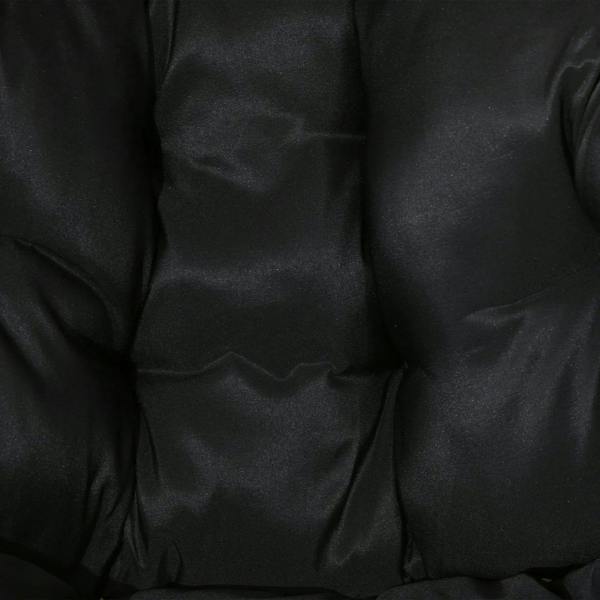 Close-up of black upholstered cushion with quilted, padded stitching