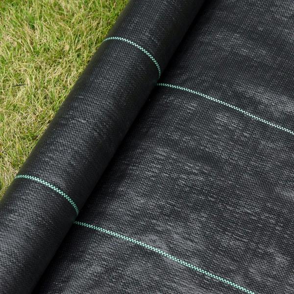 Black weed barrier fabric close-up with green guide seam lines at overlap