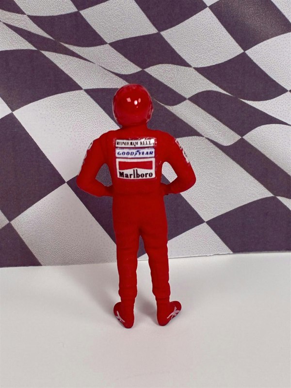 a toy figure in a red uniform