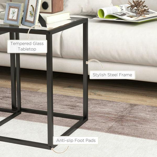 Black nesting table with tempered glass tabletop, steel legs, and protective foot pads