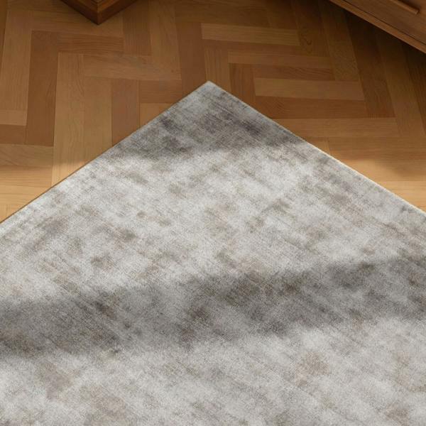 Gray rug on a wooden floor