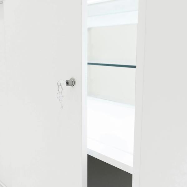 White LED retail shop counter C1500 with an open door, showcasing a sleek interior and a key in the lock for security