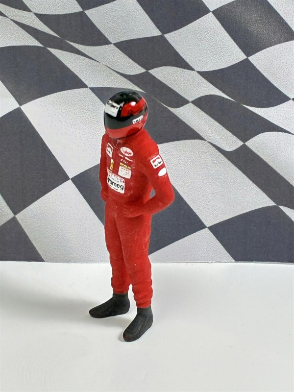 a toy figure in a red uniform