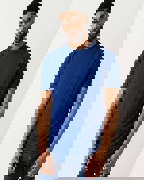 model wearing a BOSS Green Tee Mens Stretch Cotton T-Shirt with Contrast Logo in Navy