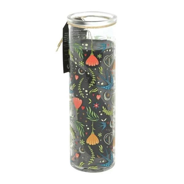French tulip tube candle in clear glass with dark background tulips and hearts