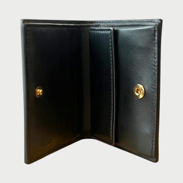 Supplied Fashion black calf leather bifold wallet with gold-tone snap button closure and interior card slots
