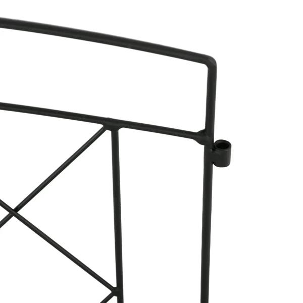 Close-up of black metal fence frame bar and connector joint for decorative panels