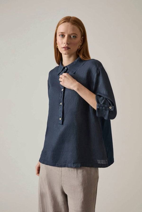 Navy linen blouse with button front and roll tabs